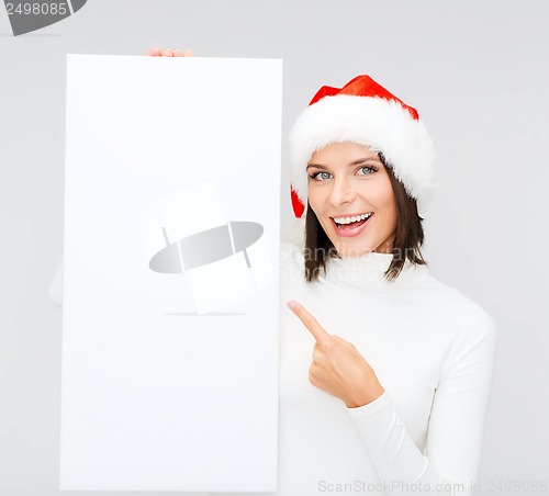 Image of woman in santa helper hat with blank white board