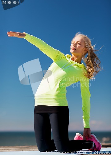 Image of woman doing sports outdoors