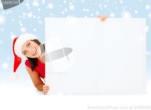 Image of woman in santa helper hat with blank white board