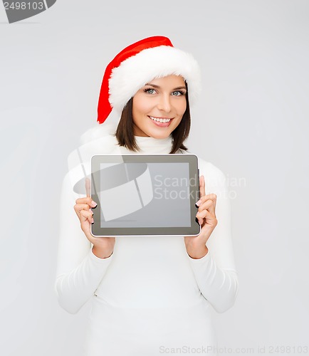 Image of woman in santa helper hat with tablet pc