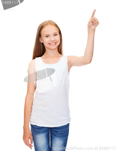 Image of girl in blank white shirt pointing to something