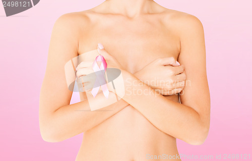 Image of naked woman with breast cancer awareness ribbon