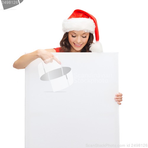 Image of woman in santa helper hat with blank white board