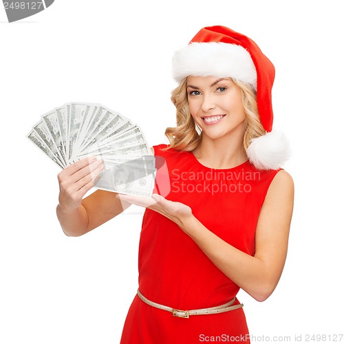 Image of woman in santa helper hat with us dollar money