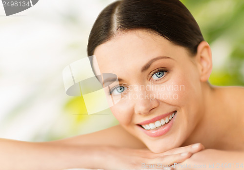 Image of beautiful smiling woman in spa salon