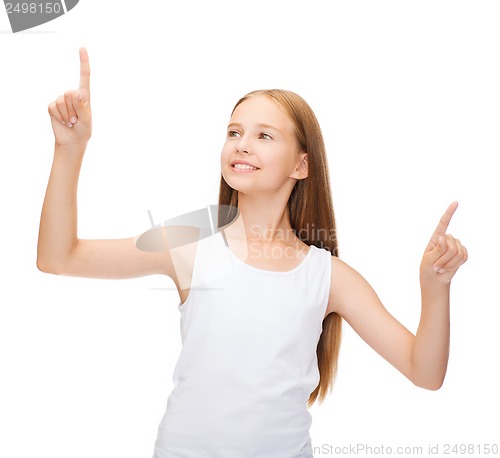 Image of girl in blank white shirt pointing to something