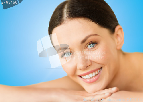 Image of beautiful smiling woman in spa salon