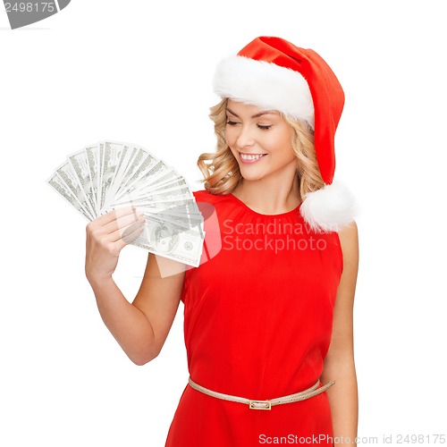 Image of woman in santa helper hat with us dollar money