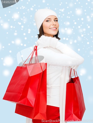 Image of picture of happy woman with shopping bags