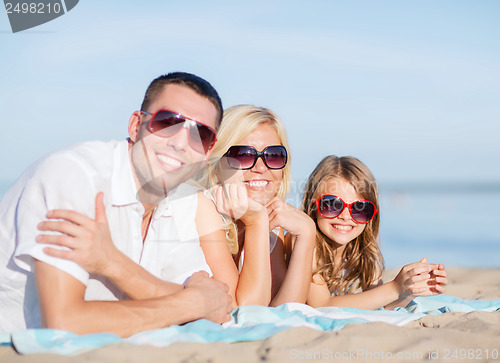 Image of happy family on the beach