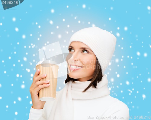 Image of woman in hat with takeaway tea or coffee cup