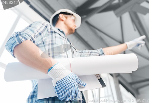 Image of man with blueprint