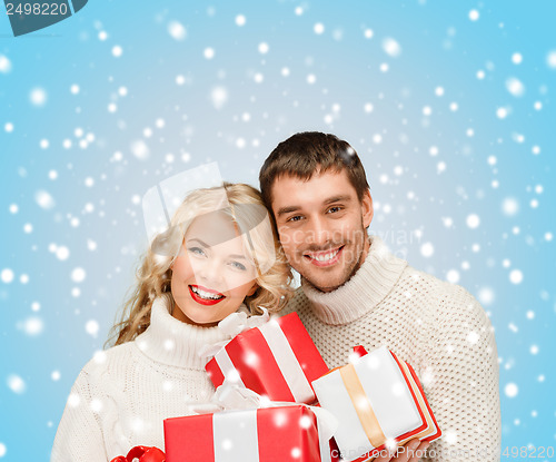 Image of smiling woman and man with gift box