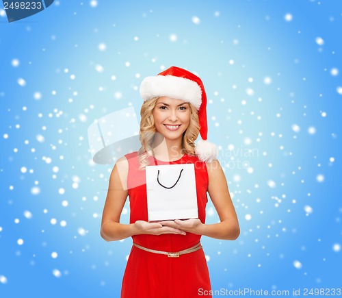 Image of woman in red dress with shopping bag