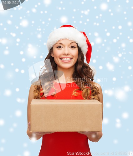 Image of smiling woman in santa helper hat with parcel box