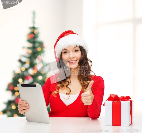 Image of woman with gift box and tablet pc computer