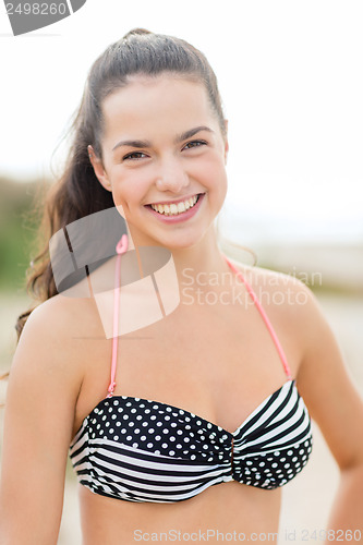 Image of girl posing on the beach