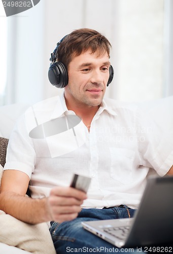 Image of man with headphones listening to music