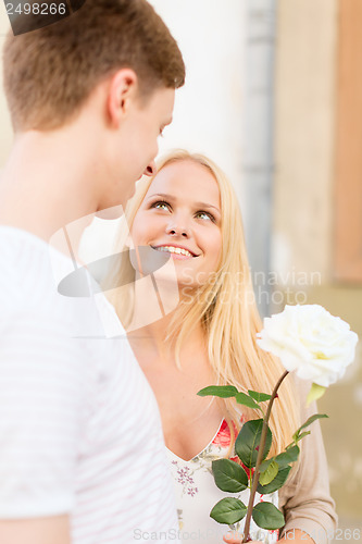 Image of couple with flowers in the city