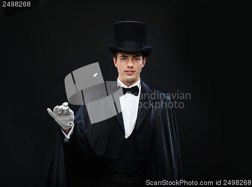 Image of magician in top hat with magic wand showing trick