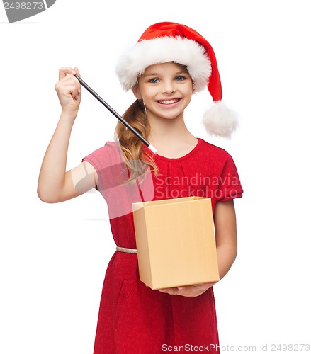 Image of smiling girl in santa helper hat with gift box