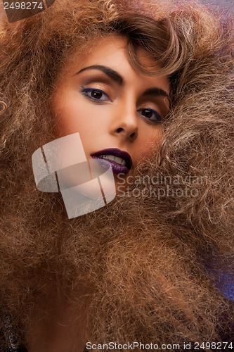 Image of woman with long curly hair