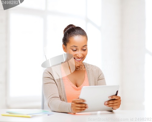 Image of smiling student girl with tablet pc