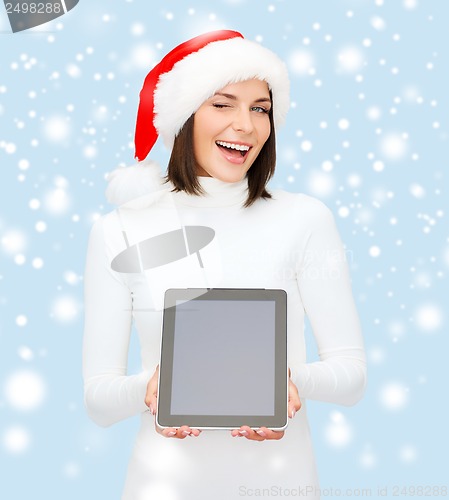 Image of woman in santa helper hat with tablet pc