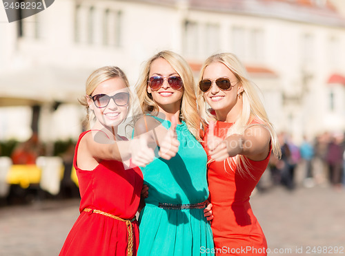 Image of three beautiful women in the city