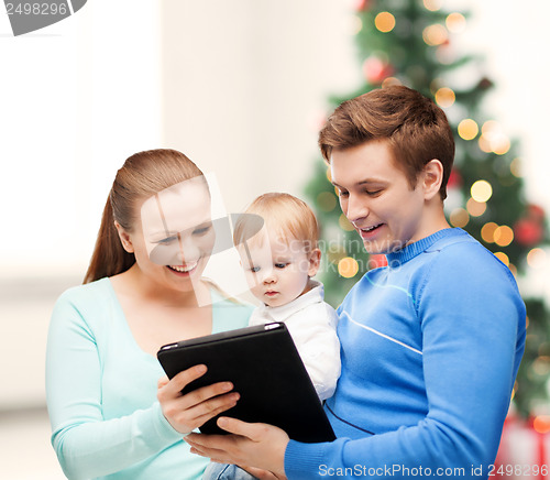 Image of parents and adorable baby with tablet pc