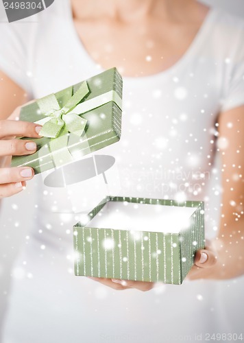 Image of woman hands with gift box