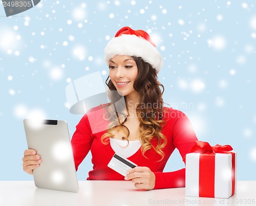 Image of woman with gift, tablet pc and credit card