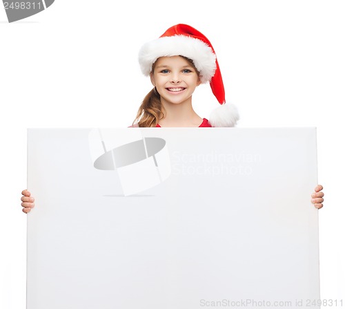 Image of woman in santa helper hat with blank white board