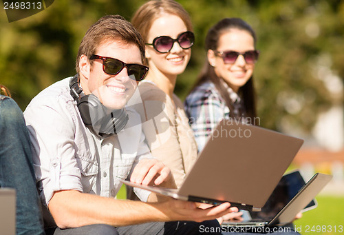 Image of students or teenagers with laptop computers