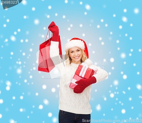 Image of woman in santa helper hat with shopping bags