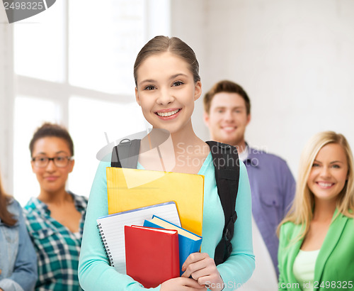 Image of student with books and schoolbag