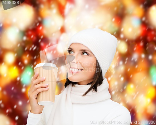 Image of woman in hat with takeaway tea or coffee cup