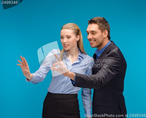 Image of woman and man working with virtual screen