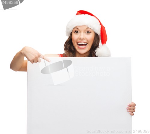 Image of woman in santa helper hat with blank white board