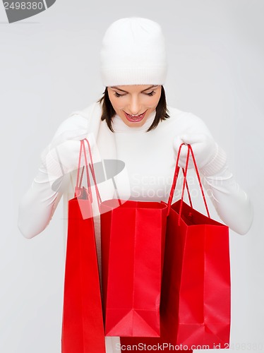 Image of picture of happy woman with shopping bags