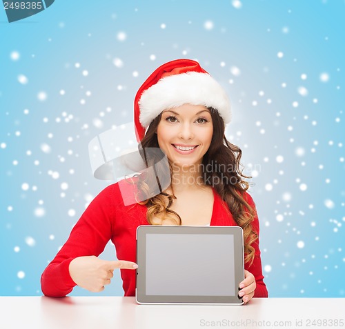 Image of woman in santa helper hat with tablet pc