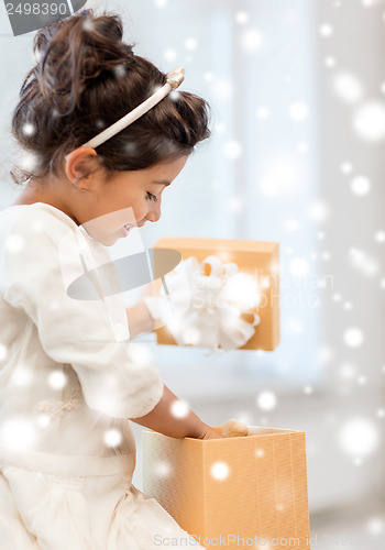 Image of happy child girl with gift box
