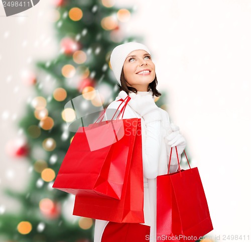 Image of picture of happy woman with shopping bags