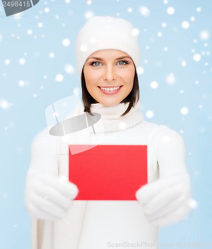 Image of woman in winter clothes with blank red card