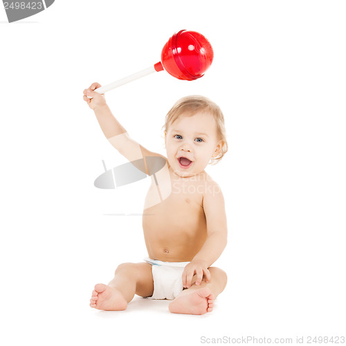 Image of cute little boy playing with big lollipop