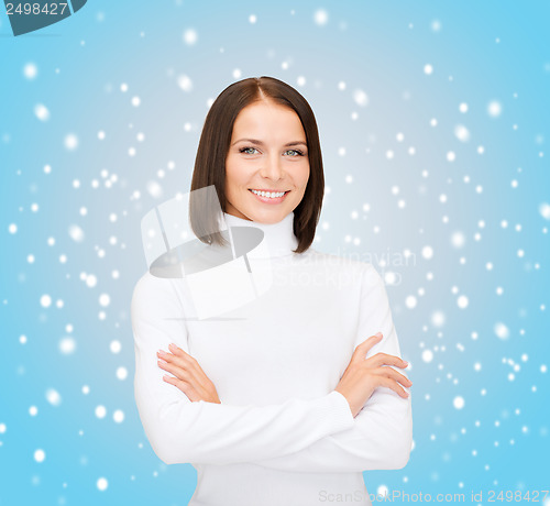 Image of smiling woman in white sweater