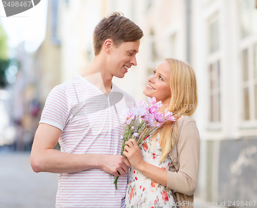 Image of couple with flowers in the city