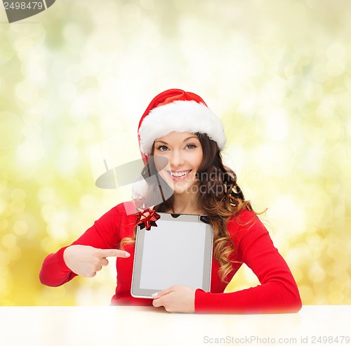 Image of woman in santa helper hat with tablet pc