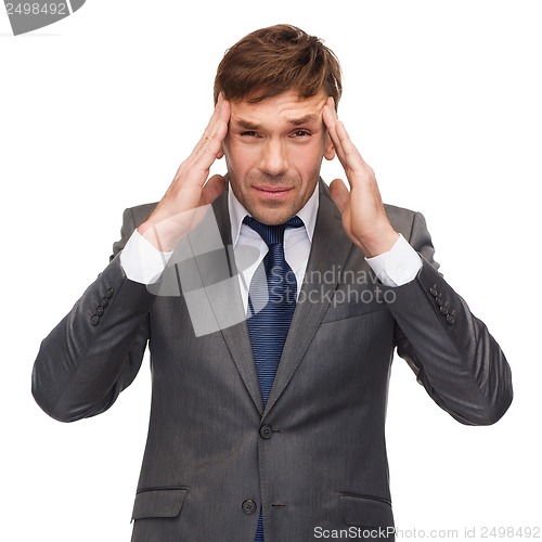 Image of stressed buisnessman or teacher having headache