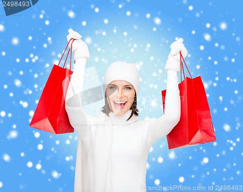 Image of picture of happy woman with shopping bags